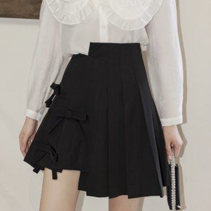 Bow irregular pleated skirt